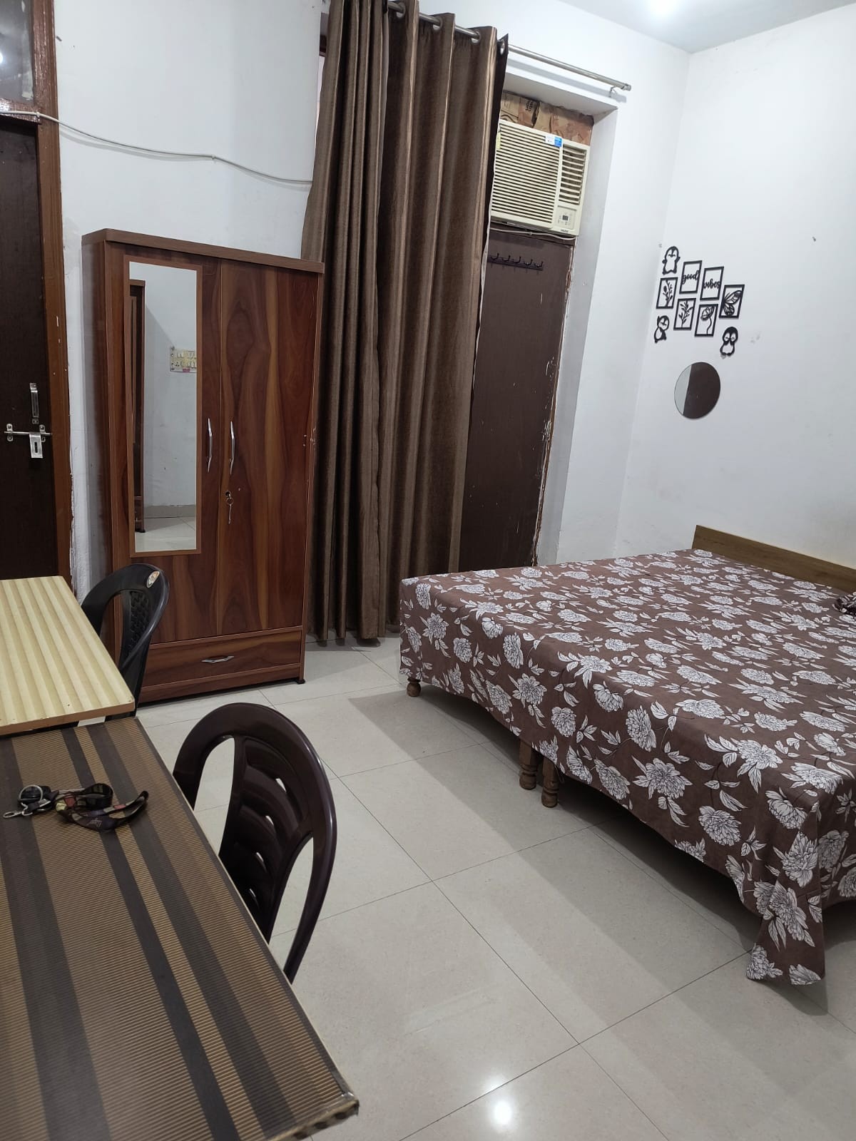 Comfortable furnished room interior at Radhey Girls PG Hostel